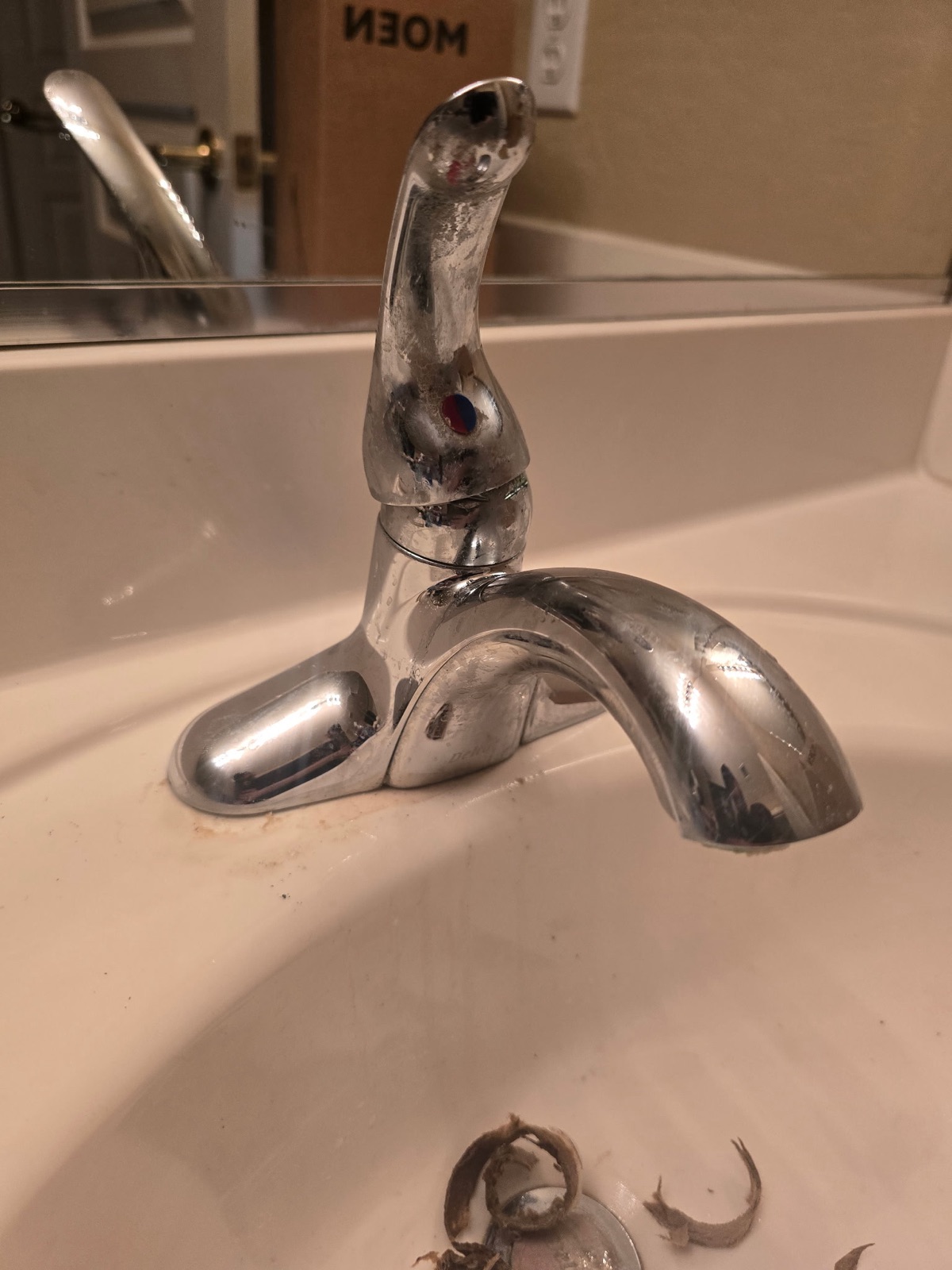 Worn bathroom faucet before replacement in a Phoenix home