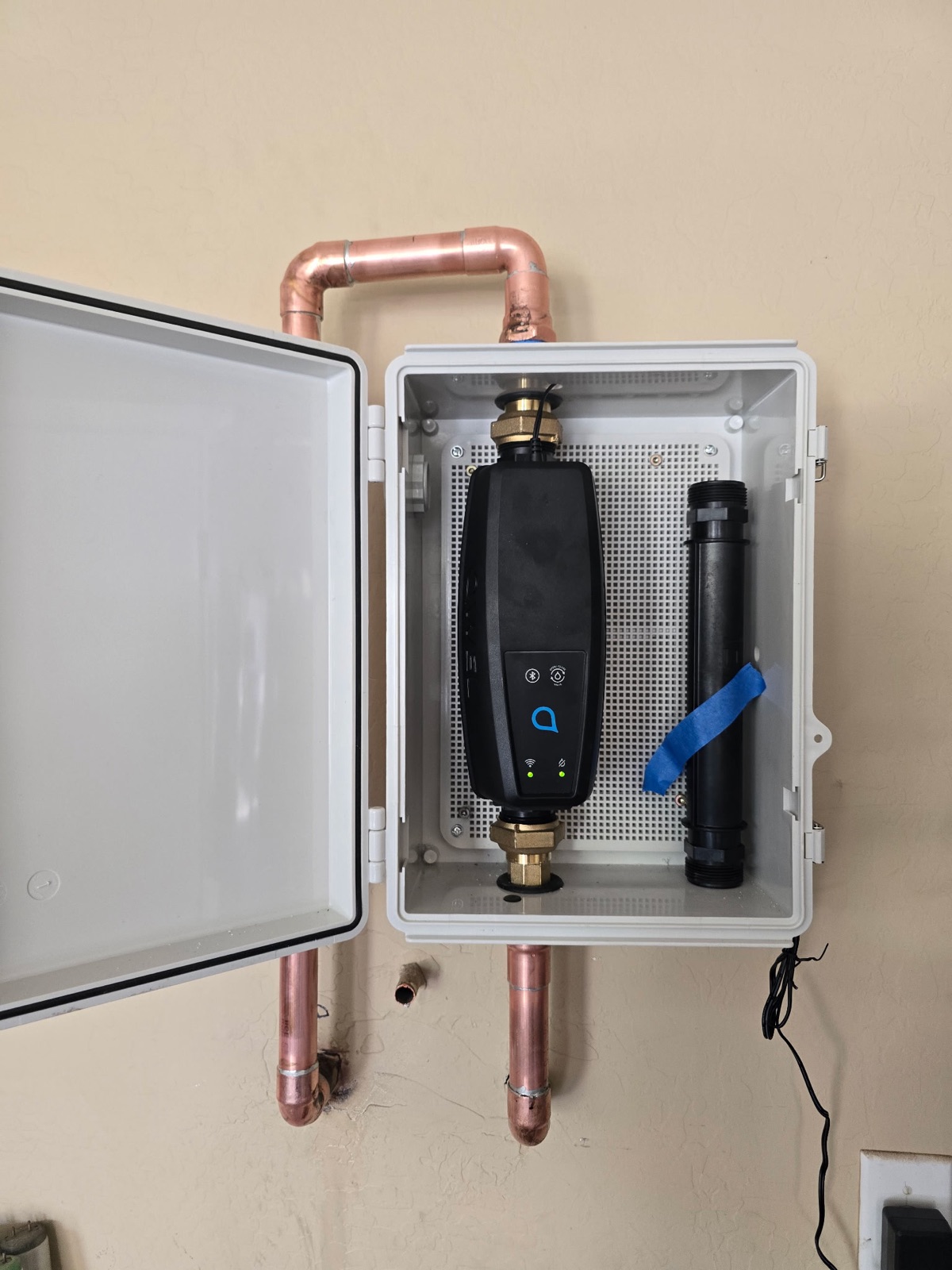 Smart automatic water shut-off valve installed in a protective enclosure on a Phoenix home's main line